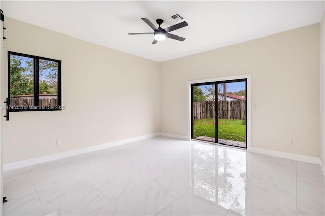 unfurnished room with ceiling fan