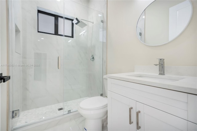 bathroom with vanity, an enclosed shower, and toilet