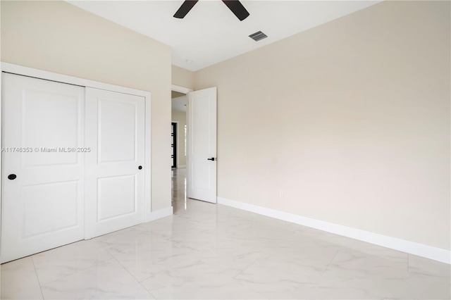 unfurnished bedroom with a closet and ceiling fan