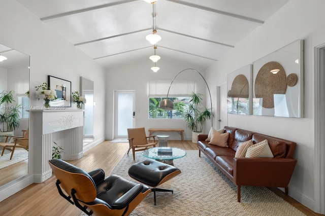 living room with light wood-type flooring and vaulted ceiling with beams