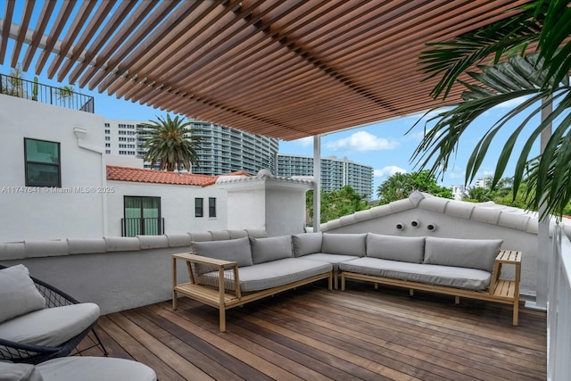 wooden terrace with outdoor lounge area