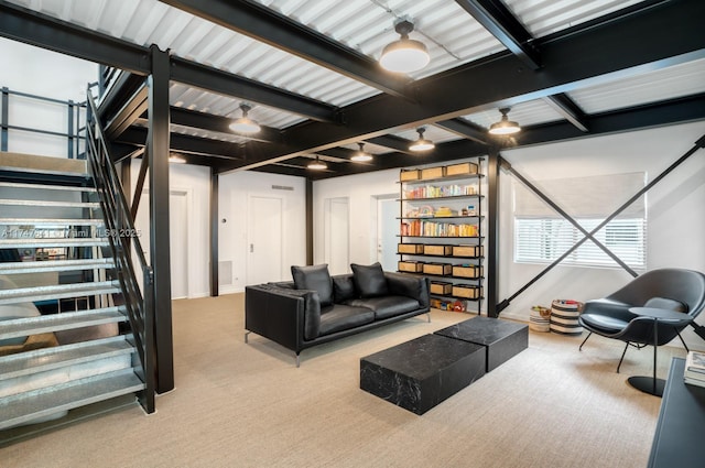 living room featuring carpet floors and beam ceiling