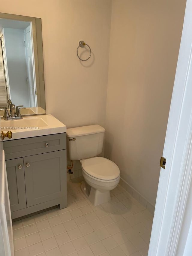 bathroom with toilet and vanity