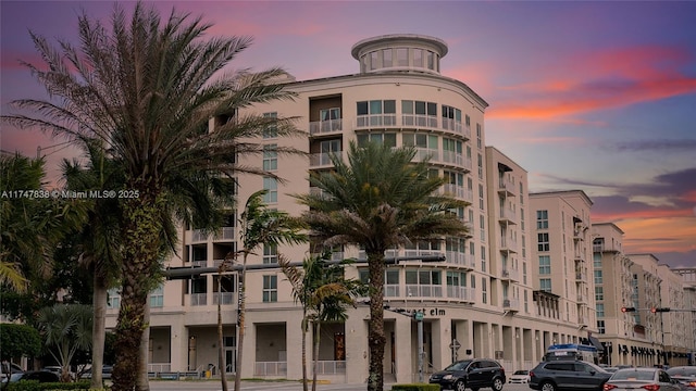 view of outdoor building at dusk