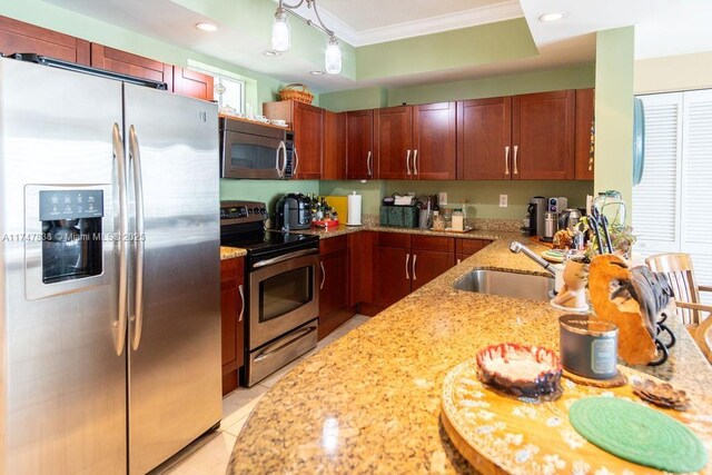 7270 SW 88th St Unit B308, Miami, FL 33156 - kitchen with stainless steel appliances, crown molding, a sink, light stone counters, and recessed lighting