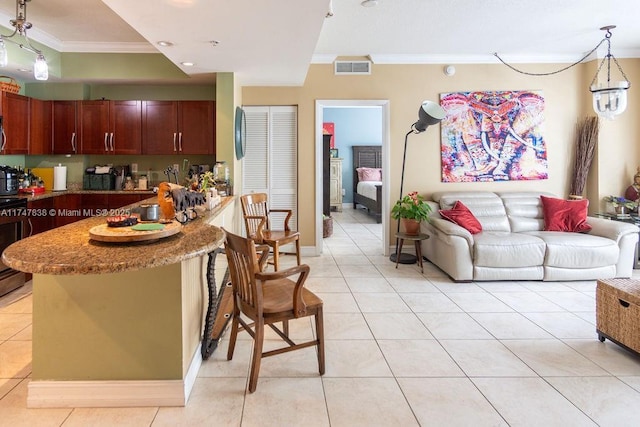 7270 SW 88th St Unit B308, Miami, FL 33156 - kitchen featuring ornamental molding, light tile patterned floors, hanging light fixtures, a kitchen bar, and stone counters