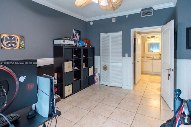 7270 SW 88th St Unit B308, Miami, FL 33156 - bedroom with wainscoting, crown molding, light tile patterned floors, a ceiling fan, and a closet