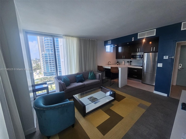 17315 Collins Ave Unit 1506, Sunny Isles Beach, FL 33160 - living area featuring plenty of natural light and baseboards
