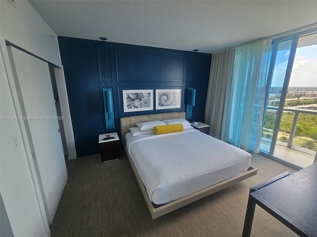 17315 Collins Ave Unit 1506, Sunny Isles Beach, FL 33160 - carpeted bedroom featuring floor to ceiling windows and multiple windows