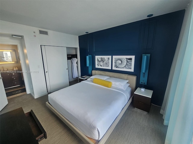 17315 Collins Ave Unit 1506, Sunny Isles Beach, FL 33160 - bedroom featuring carpet floors, a closet, and baseboards