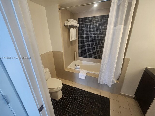 17315 Collins Ave Unit 2306, Sunny Isles Beach, FL 33160 - bathroom featuring toilet, tile patterned floors, tiled shower / bath, and vanity