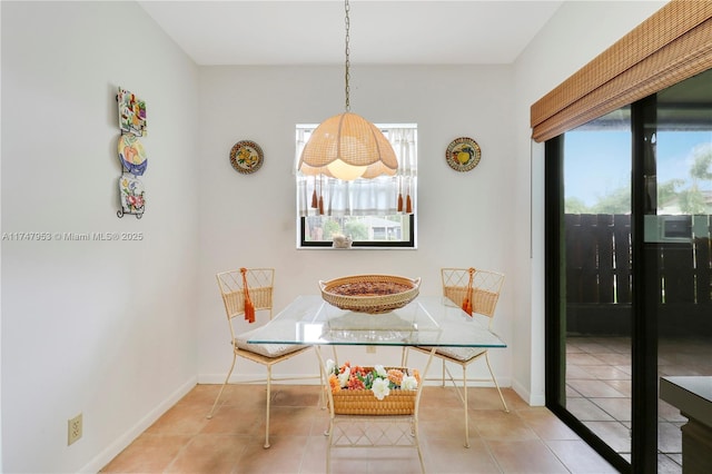 tiled dining area with baseboards