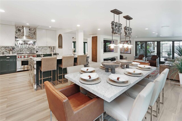 dining area featuring light wood-type flooring