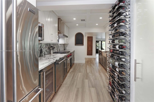 1301 Adams St, Hollywood, FL 33019 - interior space featuring beam ceiling, light wood-type flooring, coffered ceiling, and wine cooler