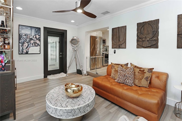 1301 Adams St, Hollywood, FL 33019 - living room featuring light wood-type flooring, ceiling fan, beverage cooler, and ornamental molding