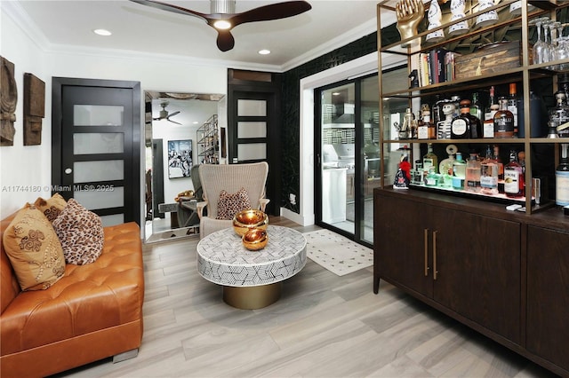 1301 Adams St, Hollywood, FL 33019 - bar with light wood-type flooring, ornamental molding, dark brown cabinetry, and ceiling fan