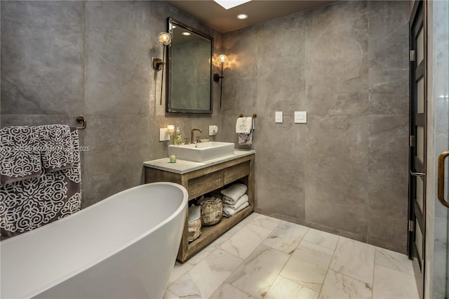 1301 Adams St, Hollywood, FL 33019 - bathroom with tile walls, a bathtub, and vanity