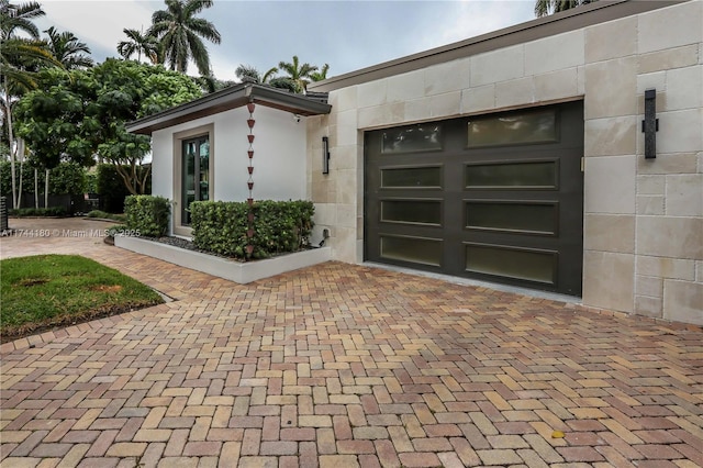 1301 Adams St, Hollywood, FL 33019 - view of exterior entry with a garage