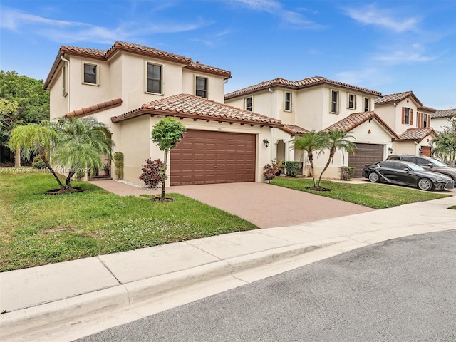 mediterranean / spanish house with a front lawn and a garage