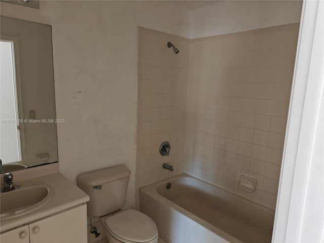 full bathroom featuring shower / washtub combination, vanity, and toilet