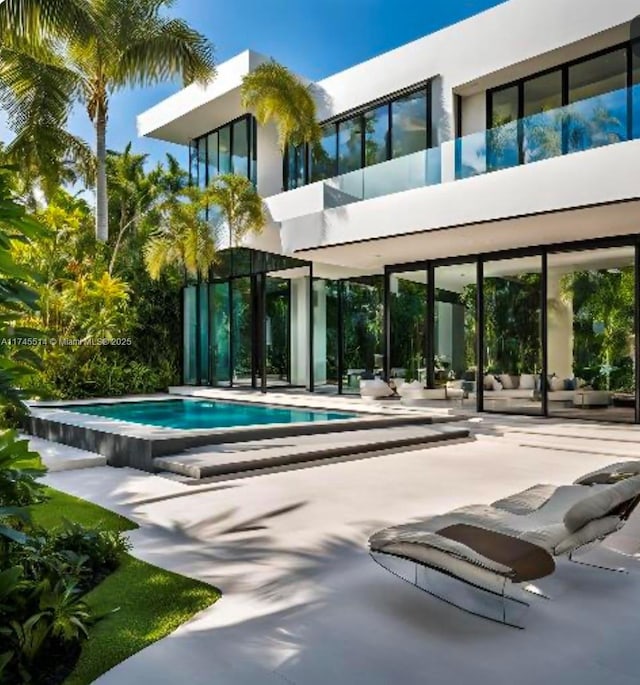 outdoor pool with a patio