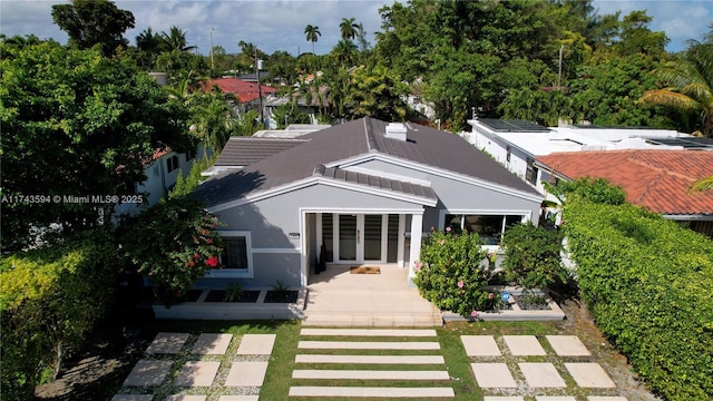 view of front of property with a patio area and french doors