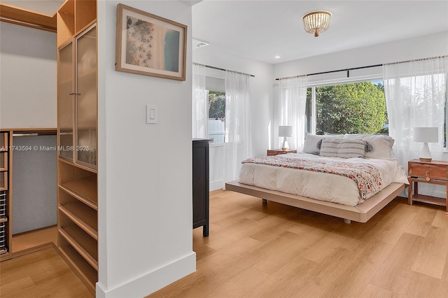 bedroom featuring light wood-style flooring