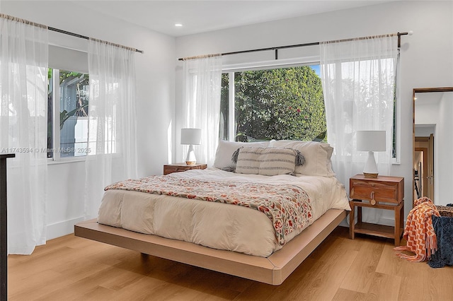 bedroom featuring light wood-style flooring