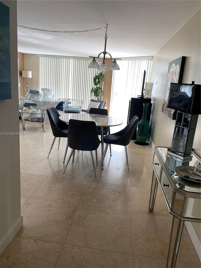 dining area featuring floor to ceiling windows and a wealth of natural light