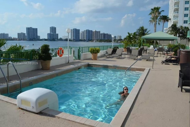 view of swimming pool featuring a gazebo and a patio area