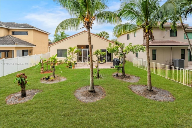 view of yard with a patio area and central air condition unit