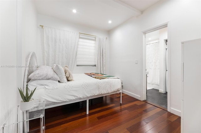 bedroom with dark wood-type flooring