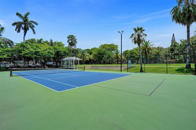 view of sport court featuring fence