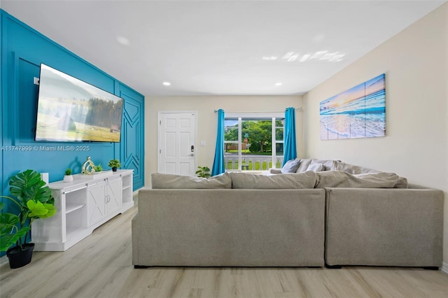 living room with light hardwood / wood-style flooring