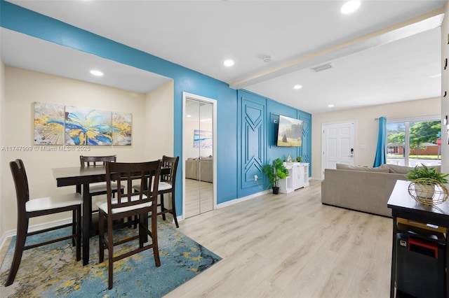 dining area with light hardwood / wood-style flooring