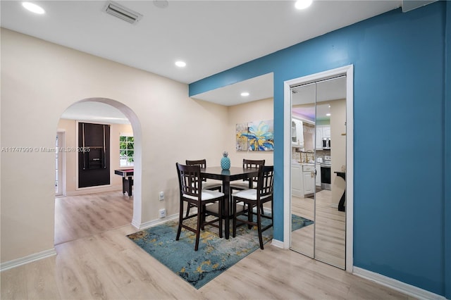 dining room featuring light wood-type flooring