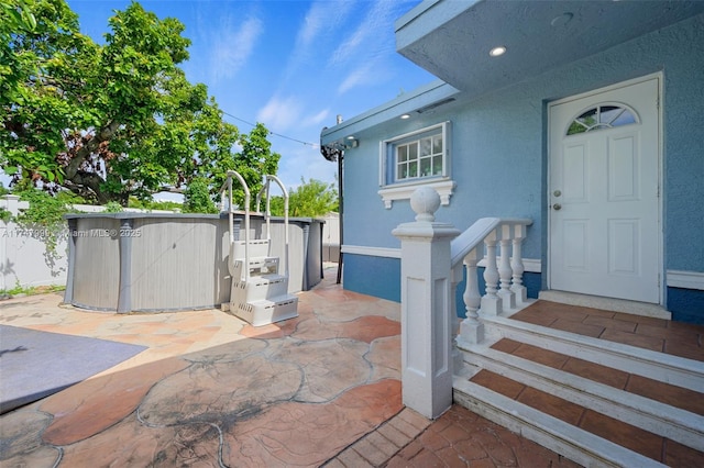 view of patio / terrace featuring a jacuzzi