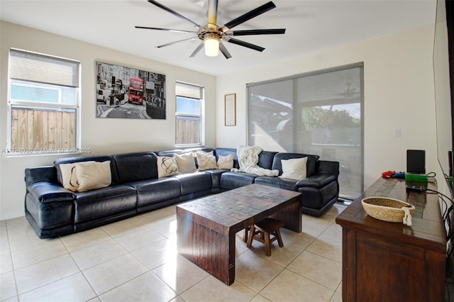 tiled living room featuring ceiling fan and plenty of natural light