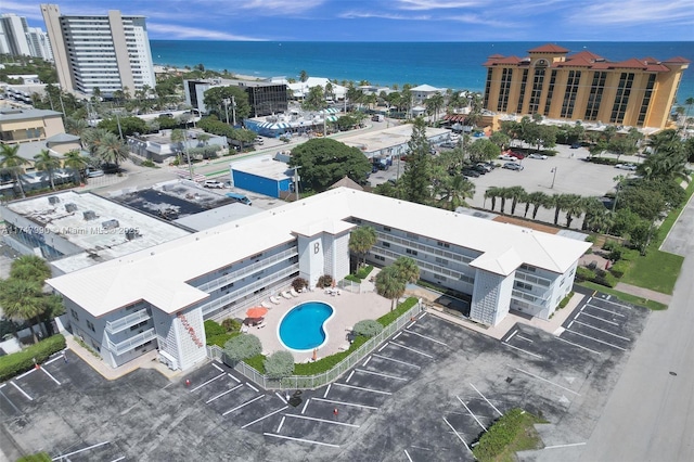 drone / aerial view featuring a water view and a view of city