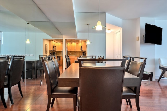 dining room with dark hardwood / wood-style floors