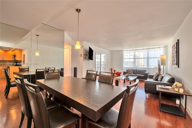 dining room with dark hardwood / wood-style floors