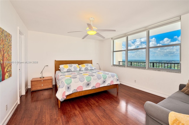 bedroom featuring dark wood-type flooring and ceiling fan