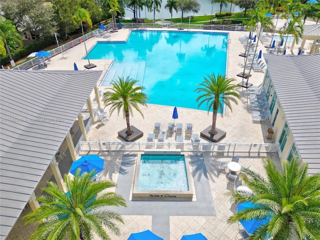 view of swimming pool featuring a patio area