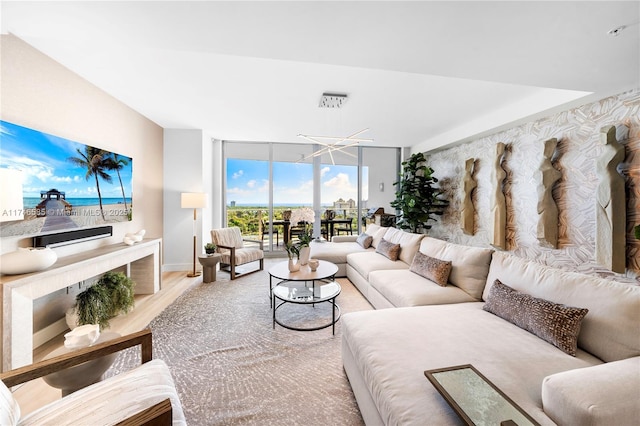 living room featuring light hardwood / wood-style flooring and floor to ceiling windows