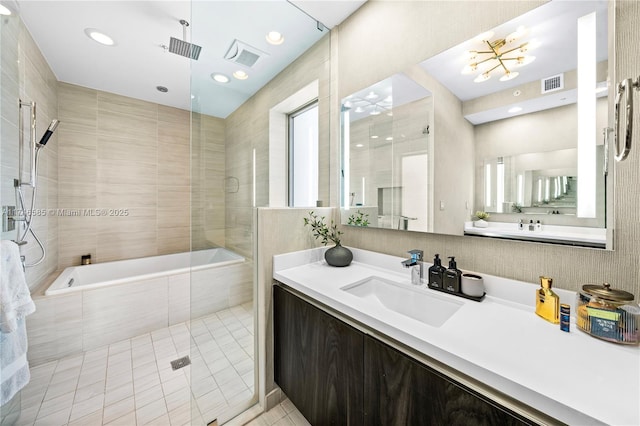 bathroom featuring tile patterned floors, separate shower and tub, and vanity