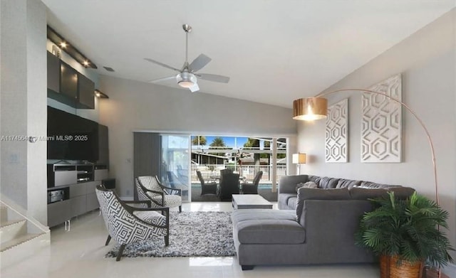 living area with high vaulted ceiling and a ceiling fan