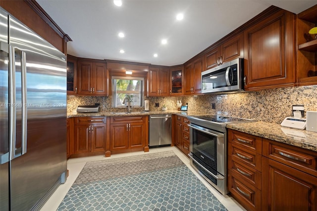 2631 Marathon, Fort Lauderdale, FL 33312 - kitchen with appliances with stainless steel finishes, a sink, open shelves, light stone countertops, and backsplash