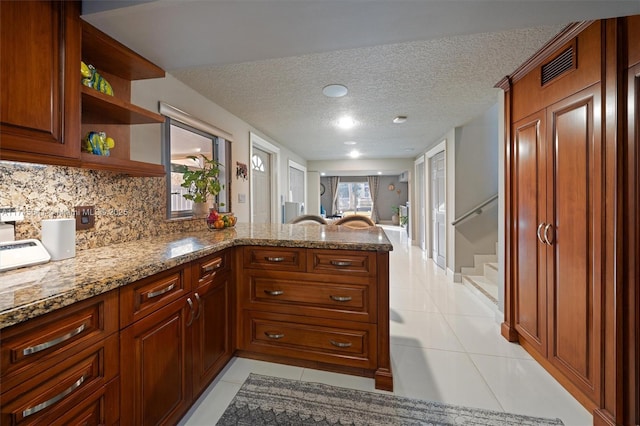 2631 Marathon, Fort Lauderdale, FL 33312 - kitchen featuring light tile patterned floors, a peninsula, open shelves, a textured ceiling, and tasteful backsplash