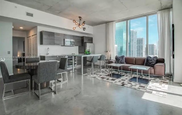 interior space featuring an inviting chandelier and beverage cooler