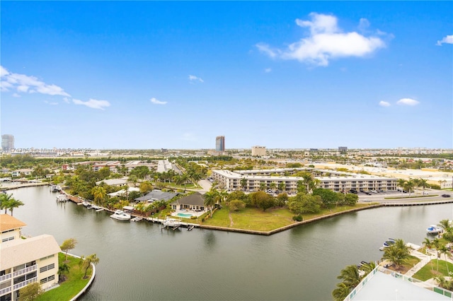 birds eye view of property featuring a water view and a view of city